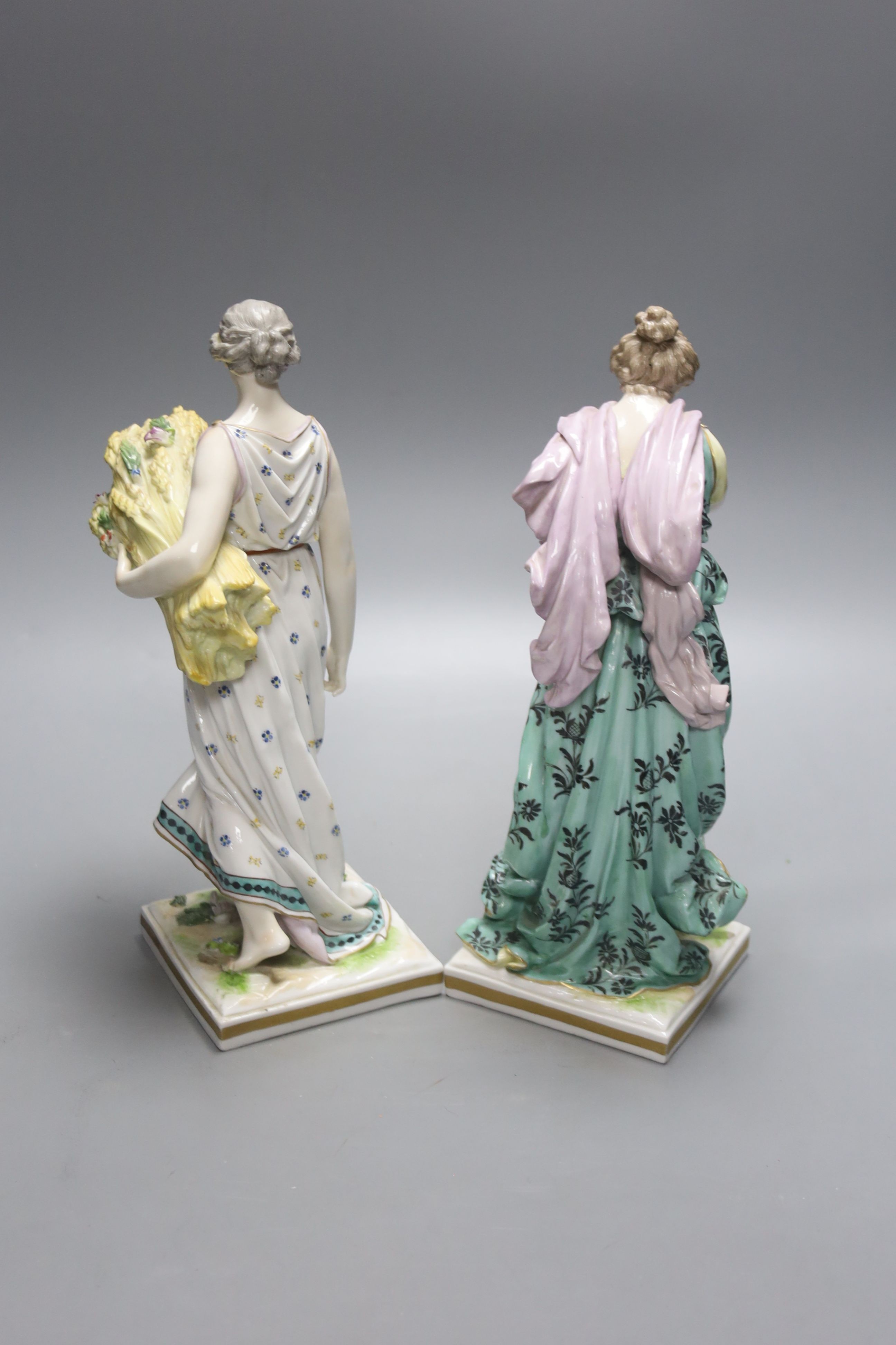 A pair of Frankenthal style figurines 'Spring' and 'Autumn', height 27cm